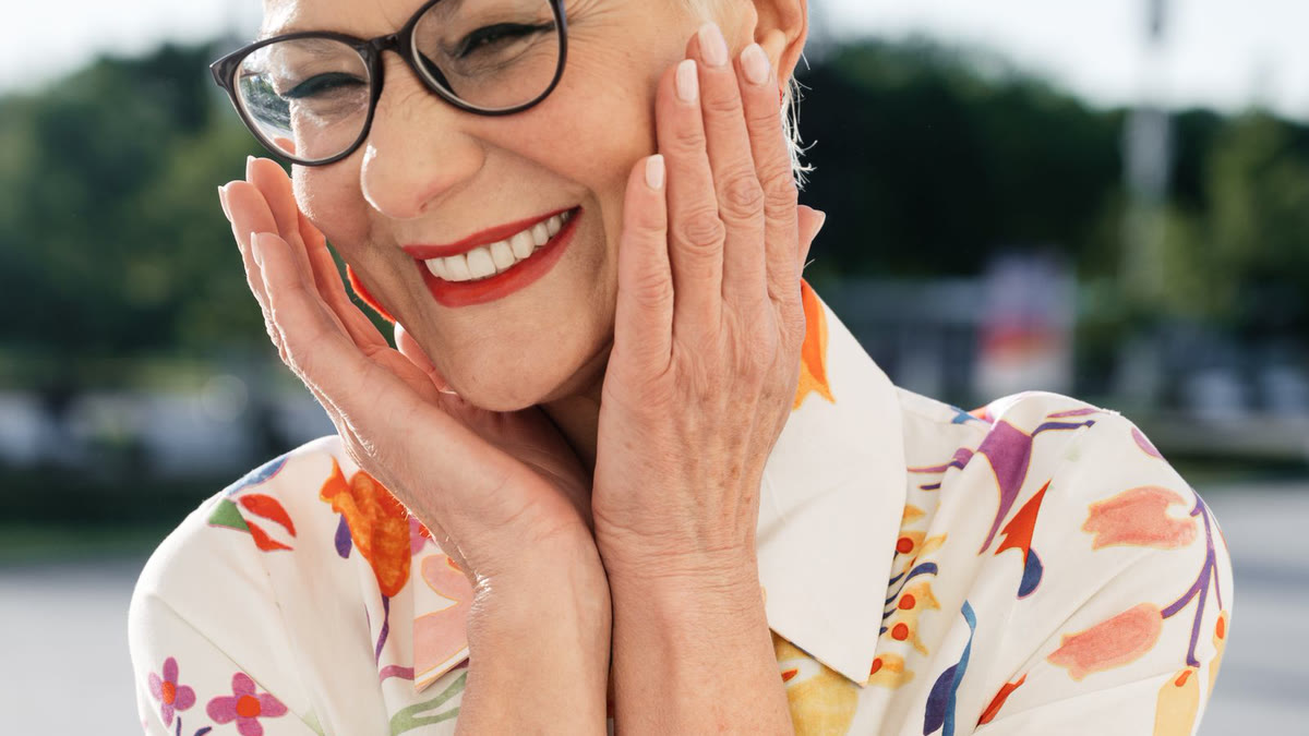 A woman in her fifties looking clear-eyed and energized, evoking the return of focus and drive that testosterone restoration can bring.