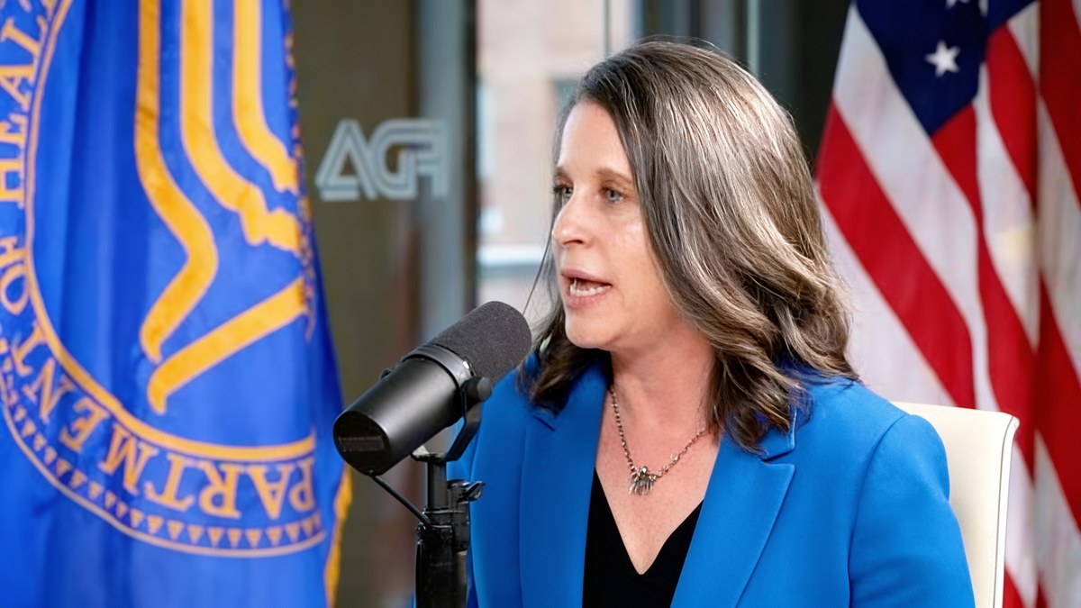 Dr. Rachel Rubin, urologist and sexual medicine specialist, speaking into a microphone before a public health panel about vaginal estrogen.